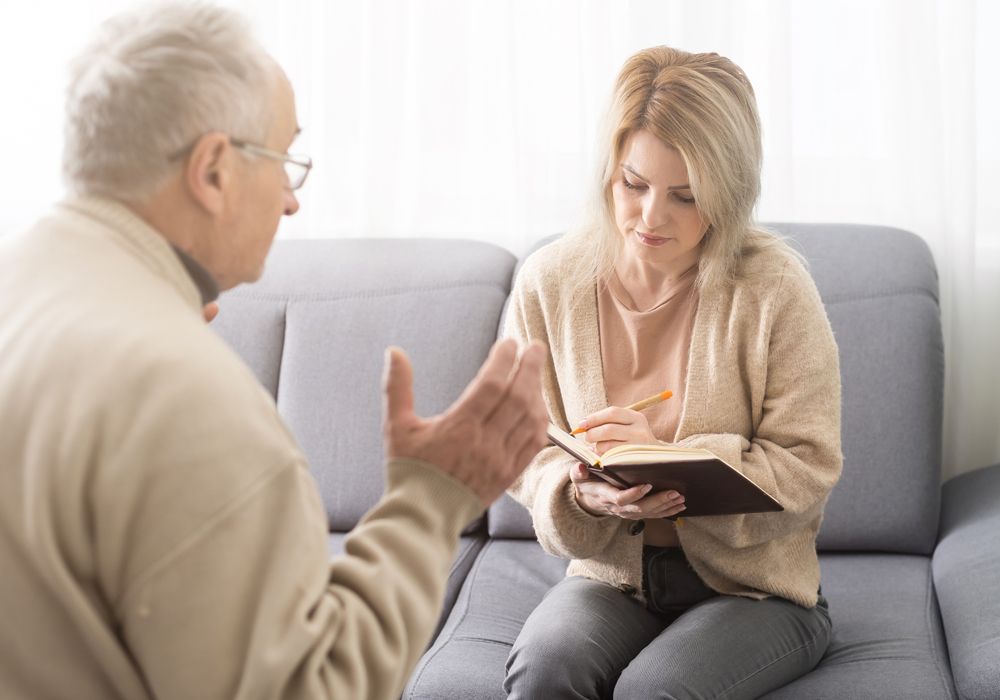 four senior people enjoying an outdoor meal together